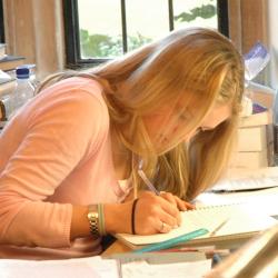 A girl working in Trinity Hall's Jerwood Library