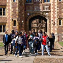 Student leading tour group in College