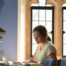Girl studying in Trinity Hall library