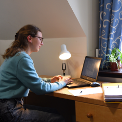 Pembroke College Applying to Cambridge Webinars Student looking at laptop screen