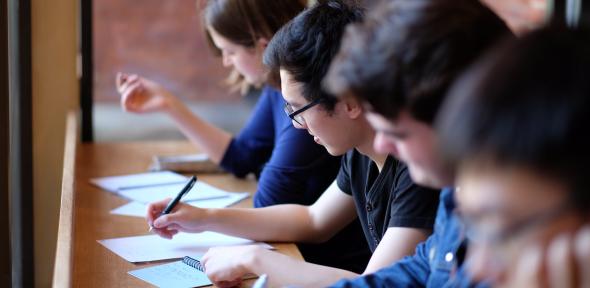 Group of students writing a test
