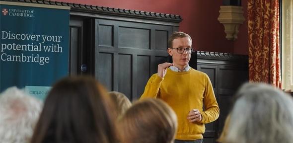 Presentation at the 2024 International Guidance Counsellor Conference Man in yellow jumper presenting to a room of teachers