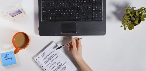 preparing to apply with laptop and notepad