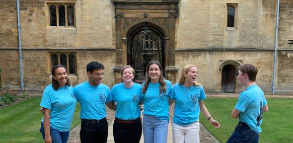 Students in front of the Gonville & Caius building